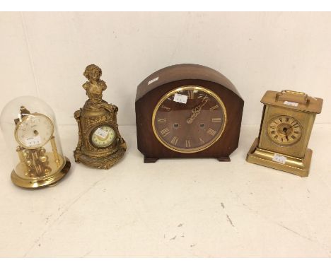 Four mantel clocks: 1. Bentima torsion or 400-day clock; 2. Smiths Enfield two-train mantel clock; 3. Brass carriage clock; 4