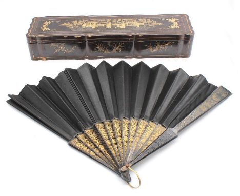 A long 19th century lacquered wooden fan box, with gilt painted Chinese Chinoiserie scene, hinged lid opening to show the int