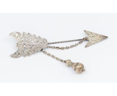 An early Victorian silver kilt/shawl pin in the shape of an arrow, with engraved detail and attached white metal safety chain