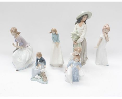 A collection of six Nao figures, two large of young ladies