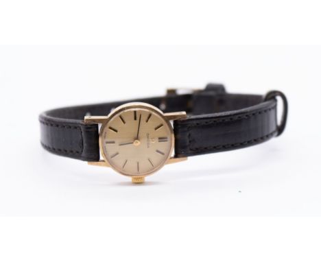 Omega- a ladies 9ct gold cased wristwatch, comprising a signed round gold tone dial, applied gilt hour indices, case approx 1