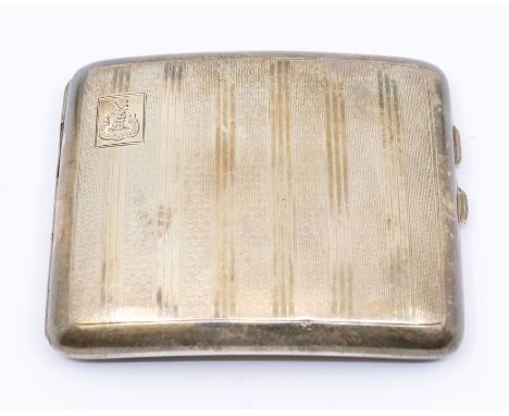 A George V engine turned silver cigarette case, of curved form, with family crest to top left corner, hallmarked, K&L, Birmin