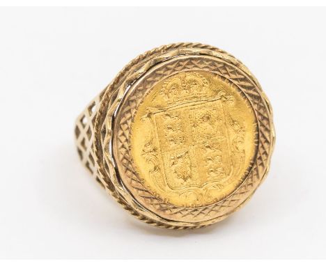 A Victorian half Sovereign ring within a pierced fancy 9ct gold ring mount, size Q, total gross weight approx 8gms   Further 