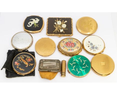 A collection of vintage gilt metal compacts, including some with decorative resin lids, to include Stratton etc along with a 