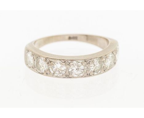 A diamond 9ct white gold half eternity ring, comprising a row of seven grain set round brilliant cut diamonds, total diamond 