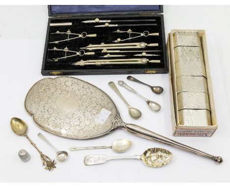 A collection of silver to include; a long floral engraved hand mirror with vacant cartouche, hallmarked Birmingham, 1969, Cha