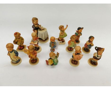 A collection of modern Goebel/MJ Hummel figurines to include; Membership year 2000/2001, 1999/2000, 1998/1999, 1997/1998, Lit