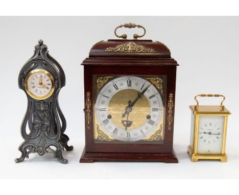 A 20th century bracket clock, with a Tander movement, the clock having gilt brass detail and dark wooden case, single handle 