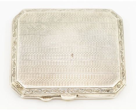 A George V engine-turned silver cigarette case, rectangular with canted corners, engraved initials 'H.K' and '21', hallmarked