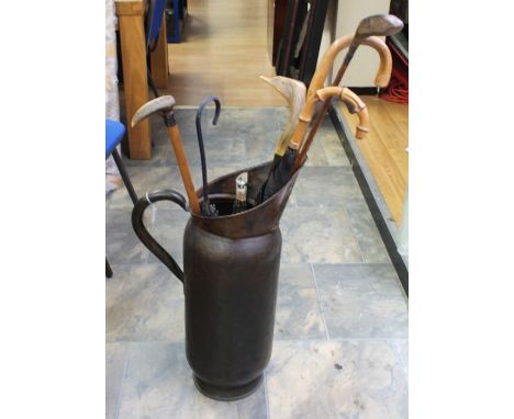 An Art Nouveau coal box together with an Edwardian coal box and a collection of walking sticks in large metalware pitcher (Q)