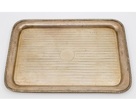 A George V rectangular engine turned silver tray, reeded and leaf border, with central vacant circular cartouche, hallmarked 