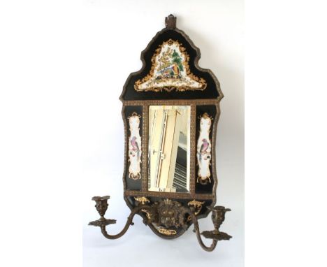 Wong Lee Porcelain - A hand painted porcelain and metal surround bevelled mirror with two elaborate candle holders to front, 