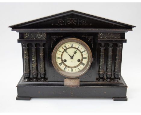 A circa 1900 Roman architectural wooden mantle clock, ebonized, 8 day with Roman numerals