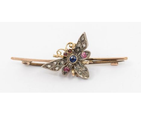 An early 20th century stone set insect brooch, set with ruby and diamonds, length approx 45mm, C clasp, unmarked assessed as 