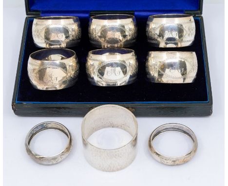 A matched set of six Edwardian napkin rings, engraved decoration and navette shaped cartouche with initial A., hallmarked by 