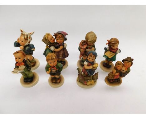 Goebel/MJ Hummel - A collection of figurines, all children to include; Surprise, Feeding Time, Soloist, Telling Her Secret. A