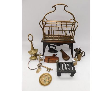 A mixed collectors lot to include; a brass and wooden Canterbury magazine rack (on four legs), various cast iron irons of var