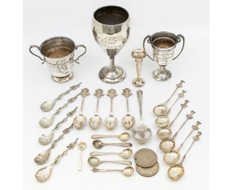 A collection of early 20th Century silver souvenir and novelty teaspoons, three various sporting trophies and posy vase, all 