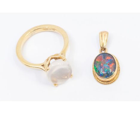 A moonstone and 9ct gold oval caw set ring, stone approx 9x11mm, size K, along with an opal doublet 9ct gold pendant, the opa