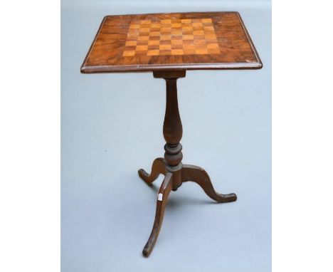 A 19th Century mahogany table with chessboard top, along with a 19th Century pole screen with tapestry detailing