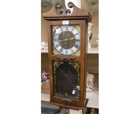 Modern President wall clock contained in a wooden case.  Dimensions 28" x 11" x 5"  Condition Movement not fully tested A/F