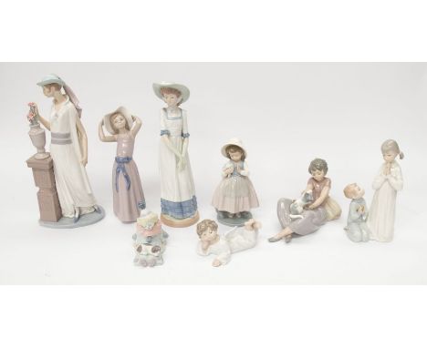 A collection of Lladro or Nao figurines to include; small young Clown, young Cherub, a few young ladies, a lady with cat, and