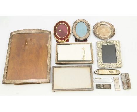 A collection of silver photo frames to include; a larger engine turned designed frame, with wooden easel back, hallmarked San