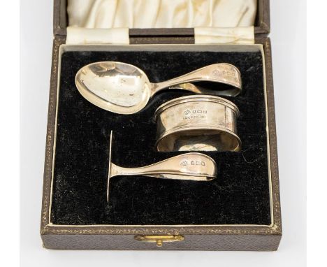 A George VI plain silver christening set including spoon, pusher and napkin ring, hallmarked by Adie Bros Ltd, Birmingham, 19