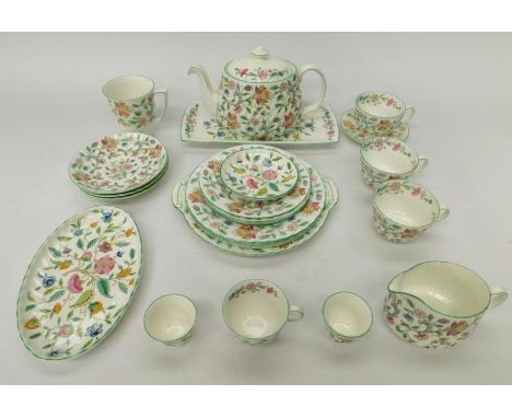 A collection of Minton 'Haddon Hall' items to include: a teapot, 3 tea cups and saucers, one coffee cup and saucer, one mug, 