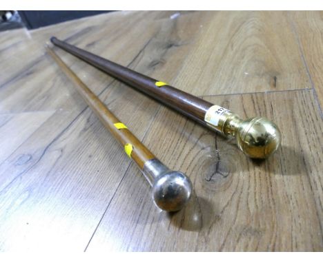 Brass topped walking stick with hollow interior and walking stick with silver hallmarked top