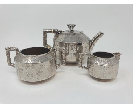 An Aesthetic Period silver plated three piece tea service, decorated in Japanese manner (3) 