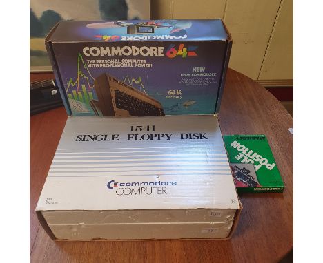 A Commodore 64 home computer, boxed USA model,  a 1541 Single Floppy Disk player, boxed USA model, and an Atarisoft Pole Posi