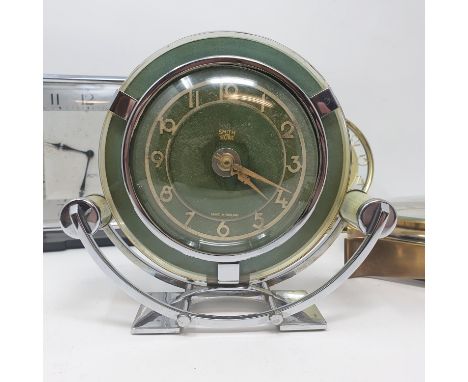 An Art Deco mantel clock, in a chrome case, 16 cm high, 18 cm wide and three others (4)The Art Deco plug has been removed, th