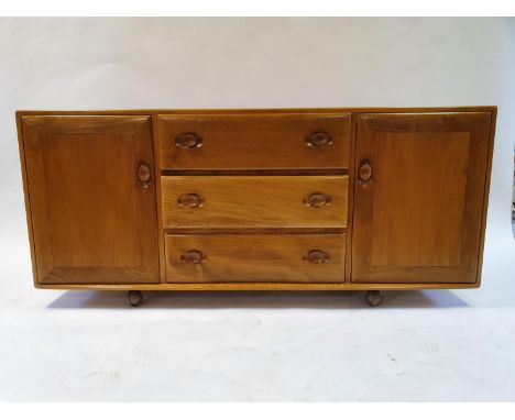 An Ercol light elm sideboard, with three central drawers and two cupboard doors, 155 cm wideBottom drawer very stiff, possibl