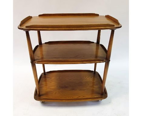 An Ercol three tier trolley, 73 cm wide, a G-Plan nest of three tables, 53 cm wide, and a coffee tableCoffee table has an Erc