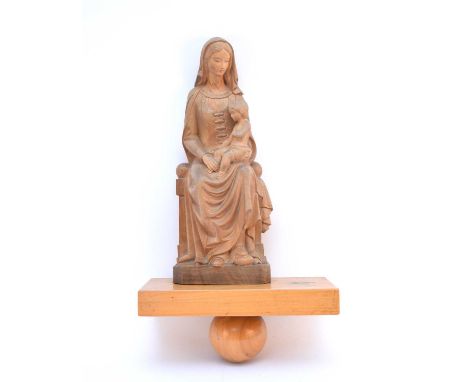 An inter-war period carved wood figure of the Madonna and child, with an associated wall bracket shelf, height excluding shel