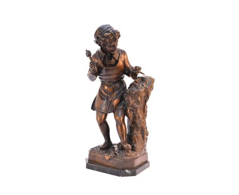 A reproduction cast bronze figure of a young MichelangeloModelled carving a head, similar to the marble sculpture by Emilio Z