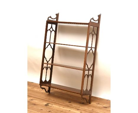 A 19th century mahogany wall shelfComprising four shelves with open fretwork sides.55.5cm wide x 17cm deep x 87cm high