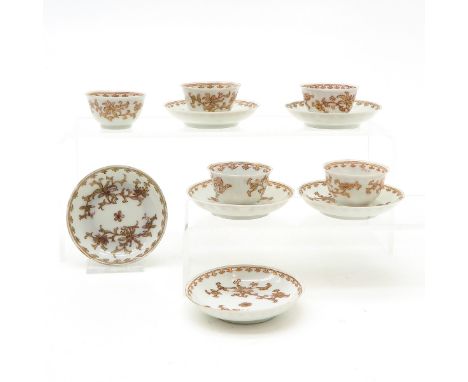 China, including 5 miniature cups and 6 miniature saucers, 6 cm. diameter, restored.