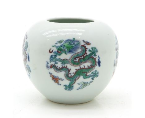 depicting dragons, 8 cm. tall, marked on the bottom with 6 characters and double ring.