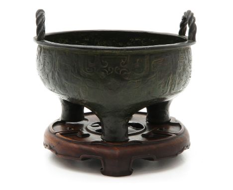 bronze, 19 cm. tall and 20 cm. diameter including wooden basement. 