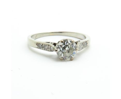 Largest diamond is 0.65 ct., ring size 17.