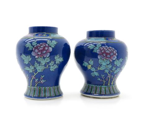 blue floral decor, marked on the bottom with double ring, 17 cm. tall, hairline, crackle in glaze.