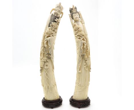 carving, depicting Chinese man and woman mounted on wooden basement, 80 cm. tall including basement. This item may not be shi