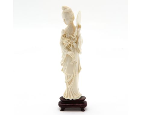 carving depicting lady with fan, mounted on wooden basement, 20 cm. tall, this item may not be shipped outside the European U