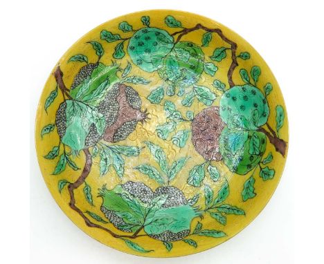 Yellow decor, marked on the bottom with dubble ring and 6 characters, 25 cm. diameter, hairline. 