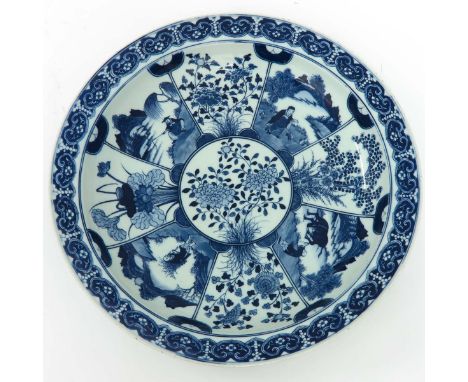 blue and white decor, 37 cm. diameter, marked on the bottom with leaf and double ring, chip.