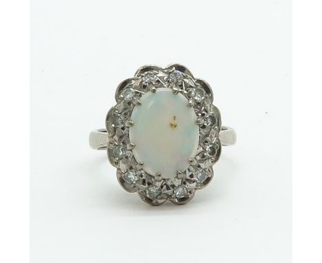 Opal is 9 x 12 mm., ring size 18.