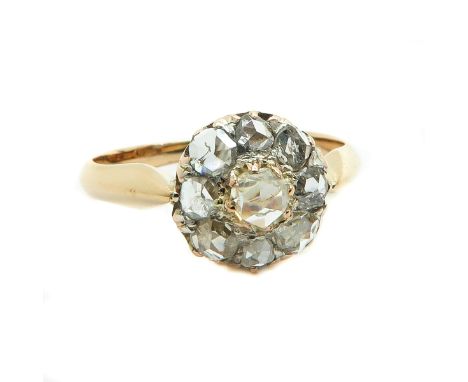 Set with many diamonds, rozet is 10 mm. in diameter, ring size 17.