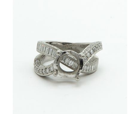 Completely surrounded with high quality brilliant and baguette cut diamonds, may be set with diamond or other stone of approx